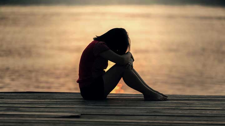 Explore the causes and symptoms of depression in teenagers