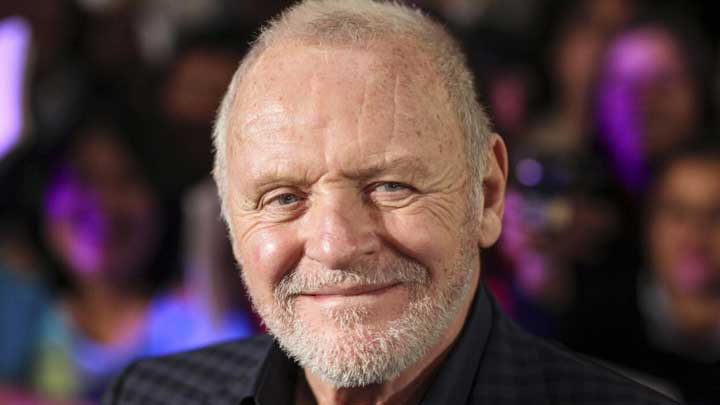 Anthony Hopkins posing at a film award function, celebrating his achievements in acting.