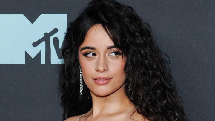 Camila Cabello attending an MTV function, radiating confidence while advocating for mental health awareness and discussing her journey with Obsessive-Compulsive Disorder (OCD).