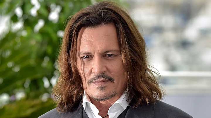 Johnny Depp attending an event, symbolizing resilience and the importance of seeking treatment for Panic Disorder and mental health challenges.