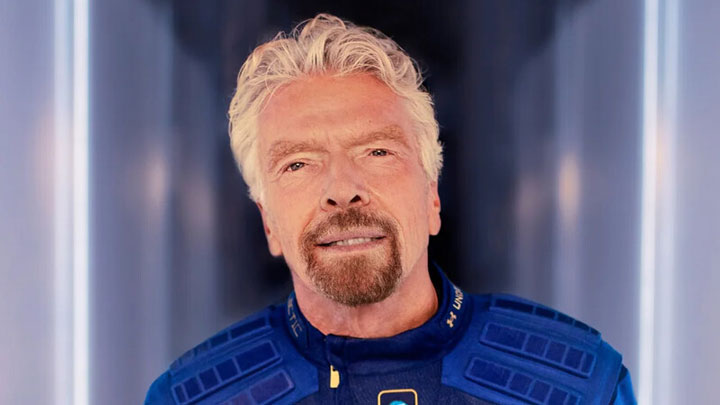 Richard Branson smiling confidently, showcasing his journey of overcoming traits associated with Oppositional Defiant Disorder (ODD) and achieving entrepreneurial success.